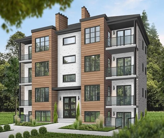 Modern four-storey apartment building showcasing expert Vancouver multi-family homes construction with contemporary design and large glass windows.